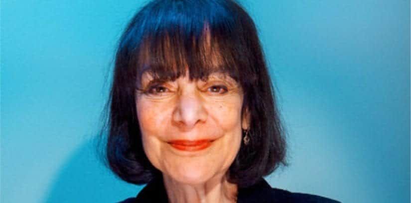A Close Up Of A Woman 's Face With A Blue Background — The Garis Group In Hamilton, NSW