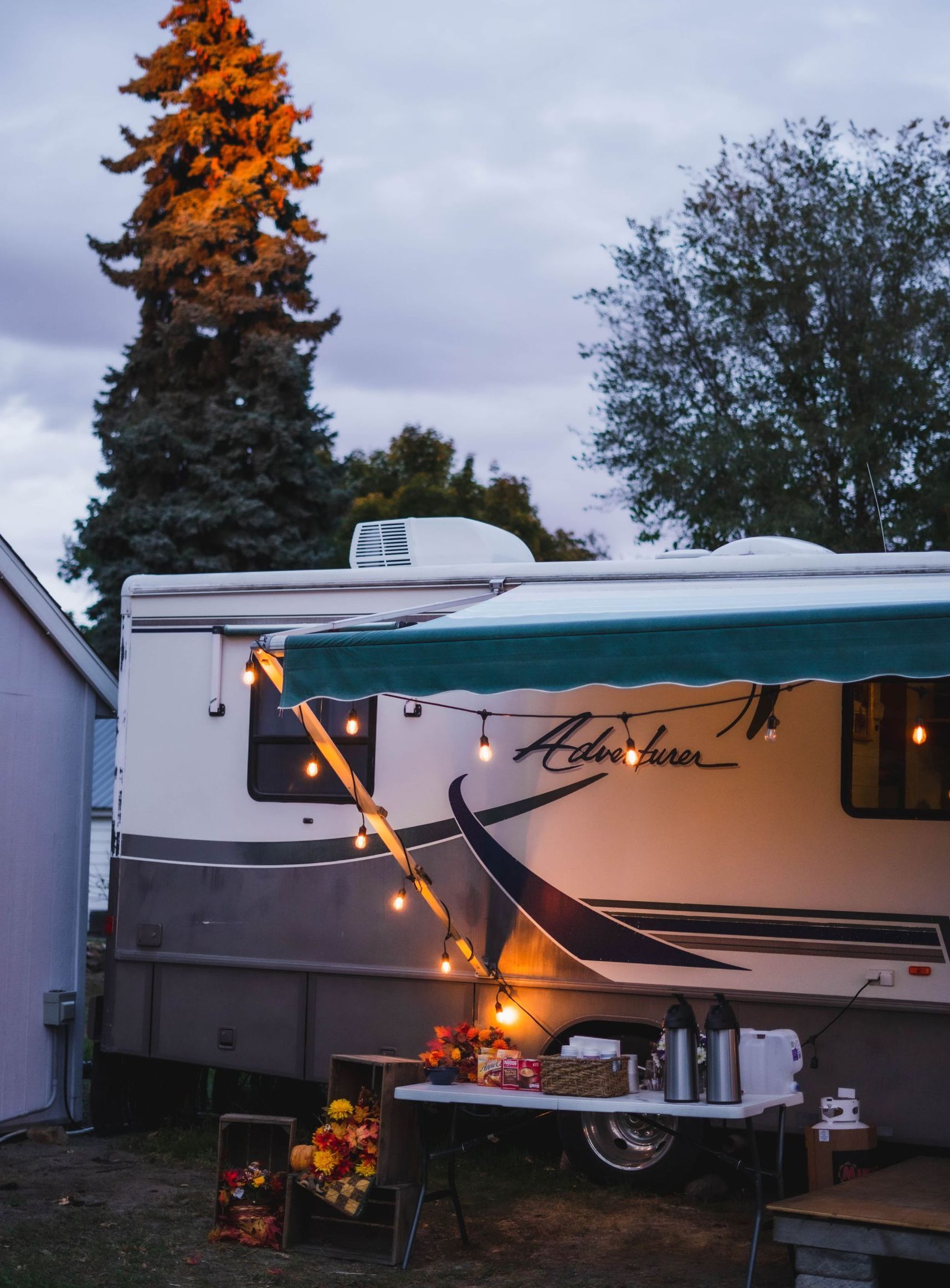the word adventurer is on the side of a trailer