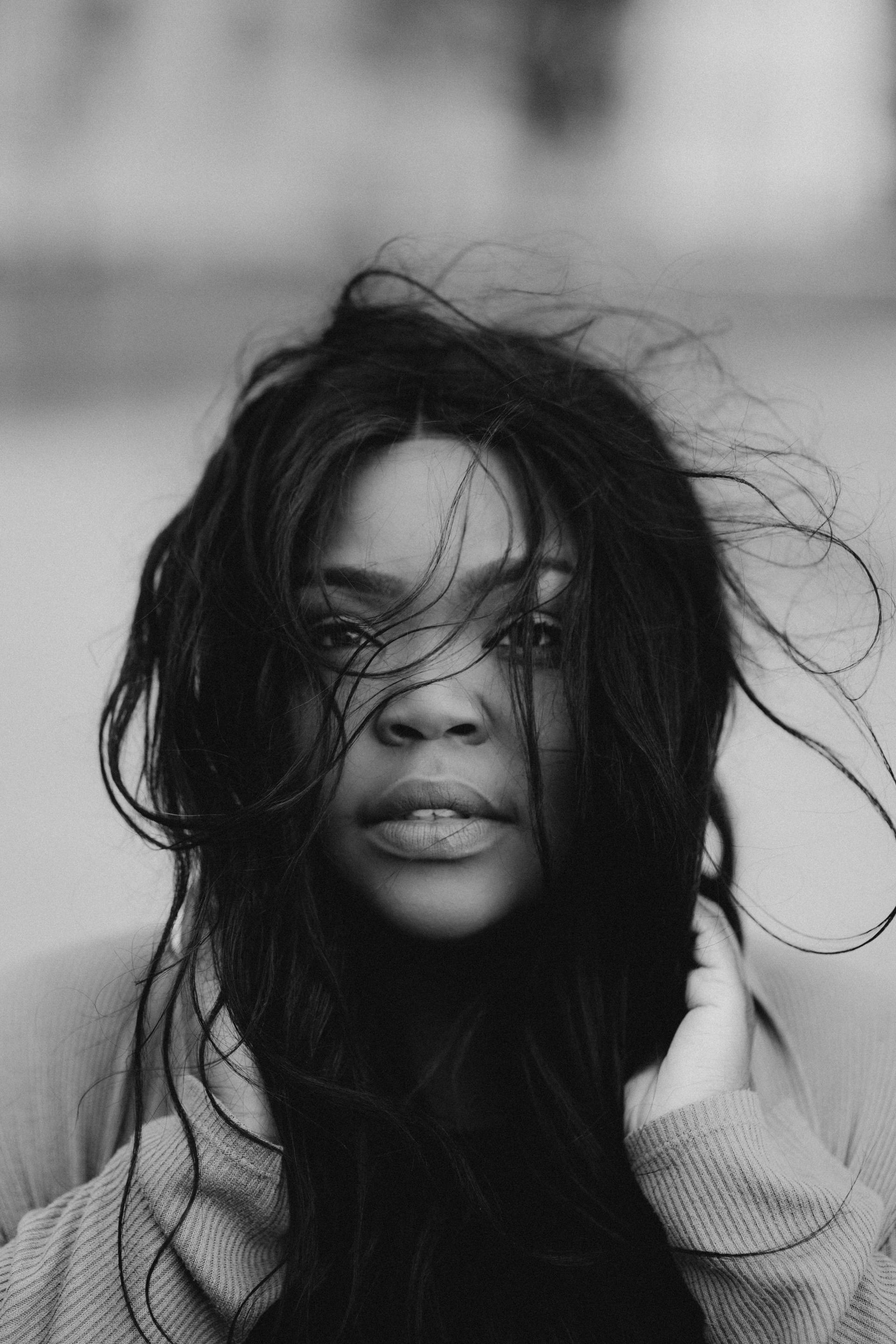 black and white woman with wind blowing hair