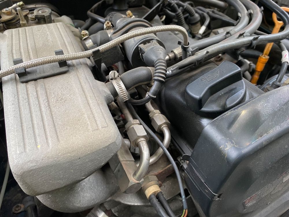 Close-up of a Car Engine Bay With Hoses — Hive Mobile Roadworthy in Pimpama, QLD