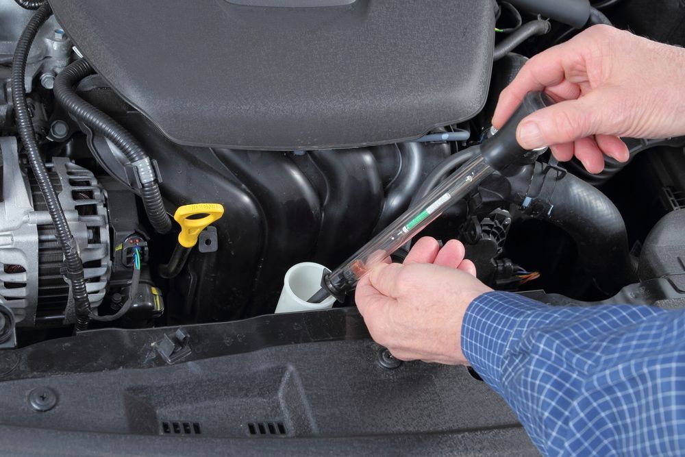 Hands Using a Wrench to Work on a Car Engine — Hive Mobile Roadworthy in Varsity Lakes, QLD