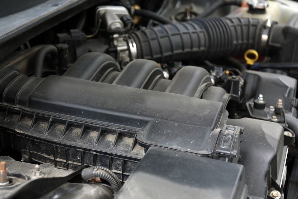 Car Engine Bay With Black Intake Components — Hive Mobile Roadworthy in Palm Beach, QLD