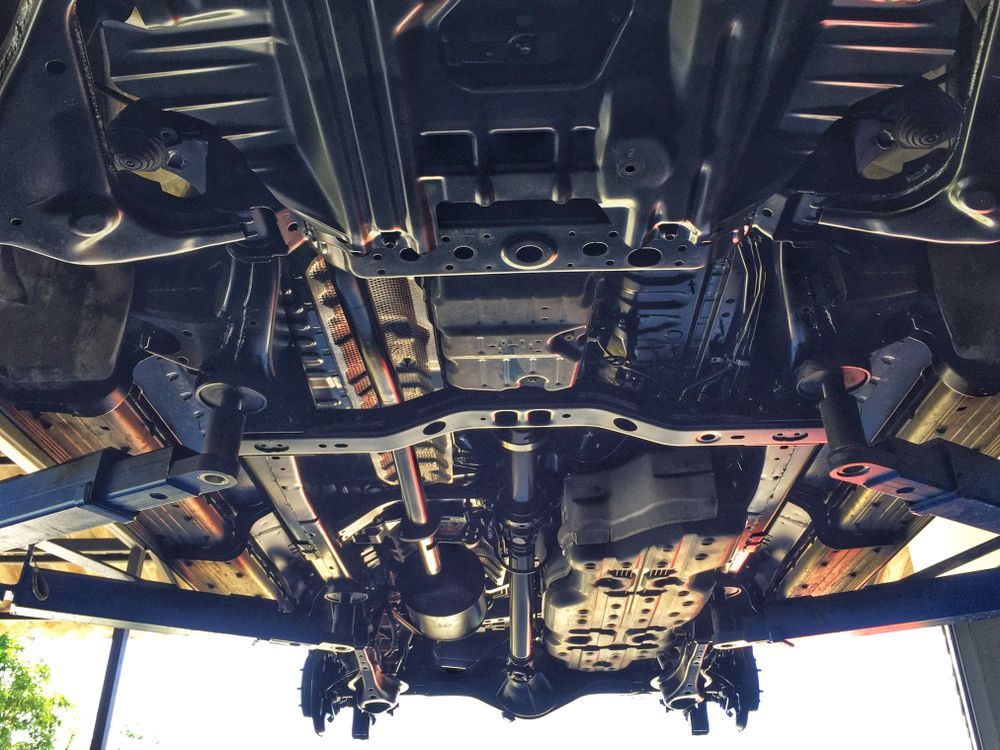 Undercarriage of a Vehicle on a Lift, Showing the Suspension Components — Hive Mobile Roadworthy in Mudgeeraba, QLD