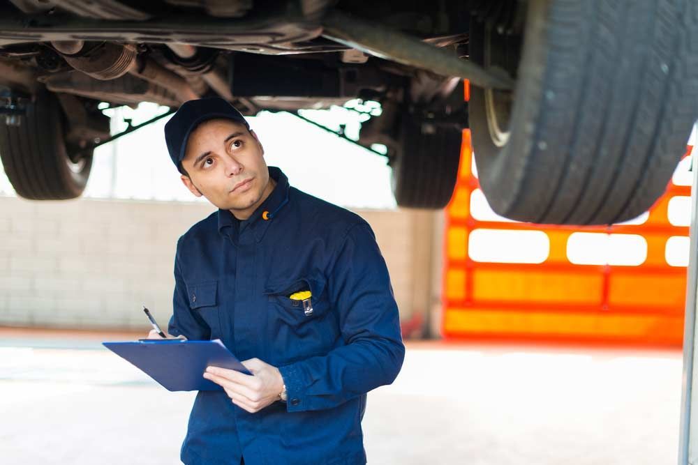 Mechanic Inspecting Underside of a Vehicle — Hive Mobile Roadworthy in Coomera, QLD