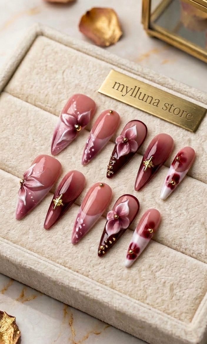 Vibrant red floral-patterned stiletto acrylic nails.