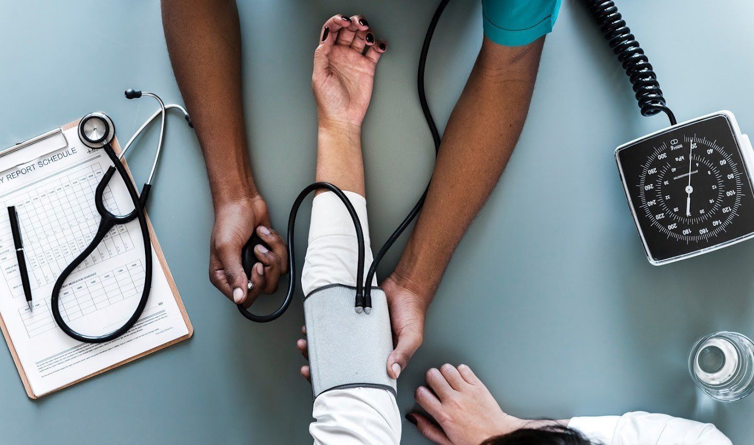 Nurse Checking Blood Pressure — Fairmont, WV — Higinbotham & Higinbotham LLC Nurse Checking Blood Pressure — Fairmont, WV — Higinbotham & Higinbotham LLC