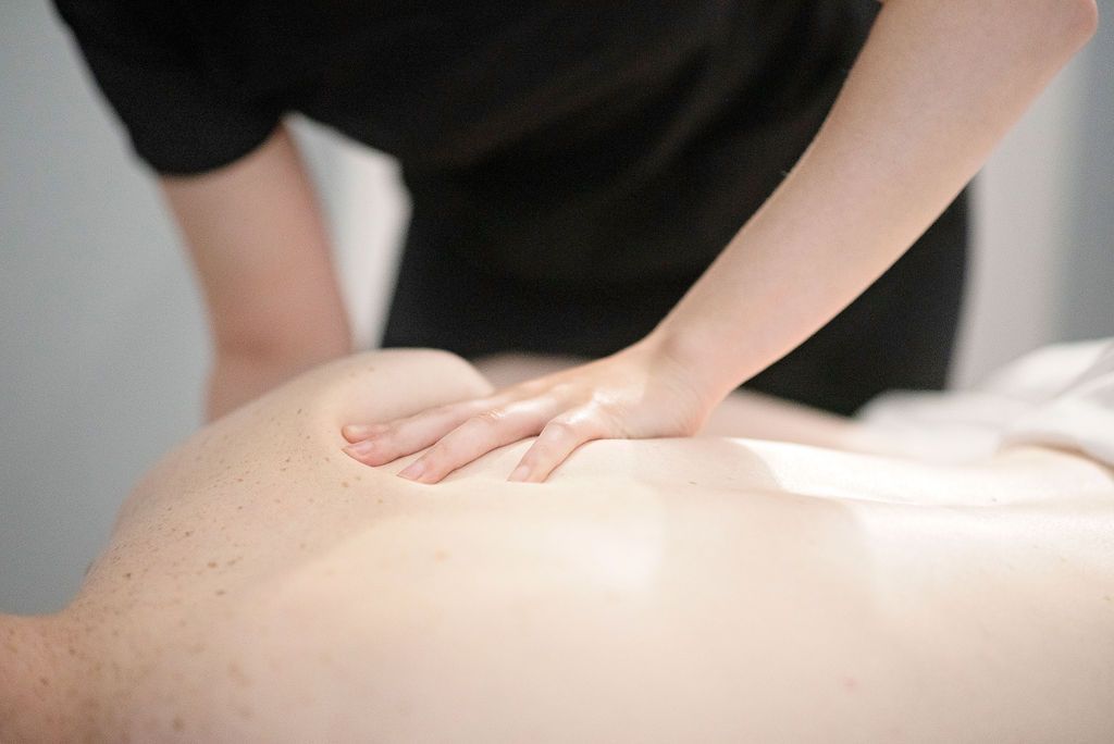 a person is getting a massage on their back