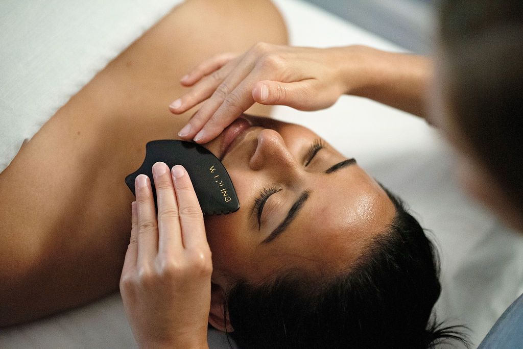 a woman is getting a massage