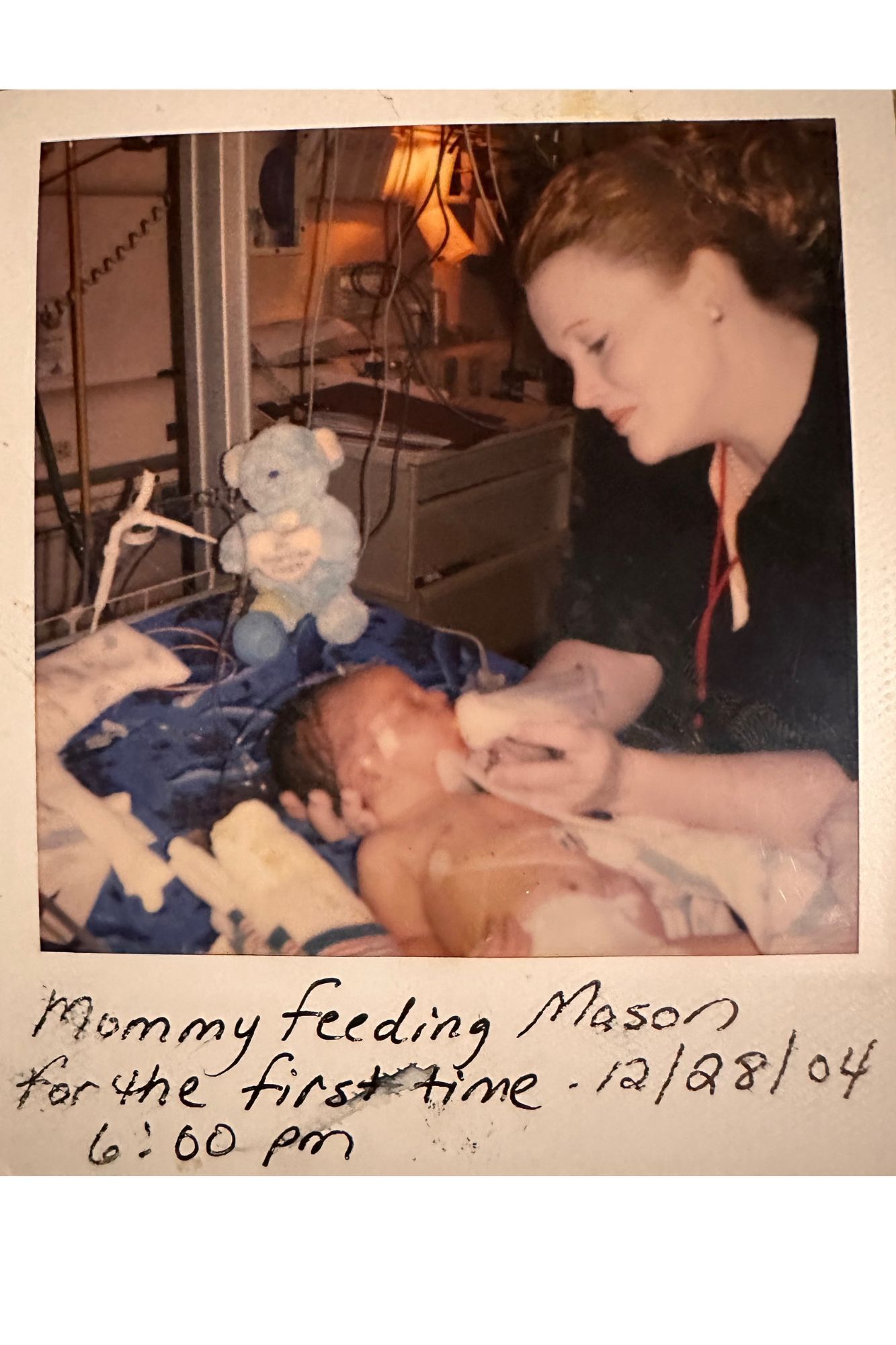 A picture of a woman feeding a baby mason