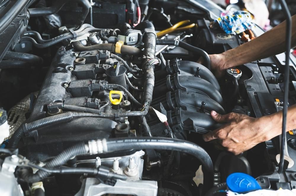 A Person Is Working on The Engine of A Car — TGR Automotive–Honda Specialist in Lismore, NSW