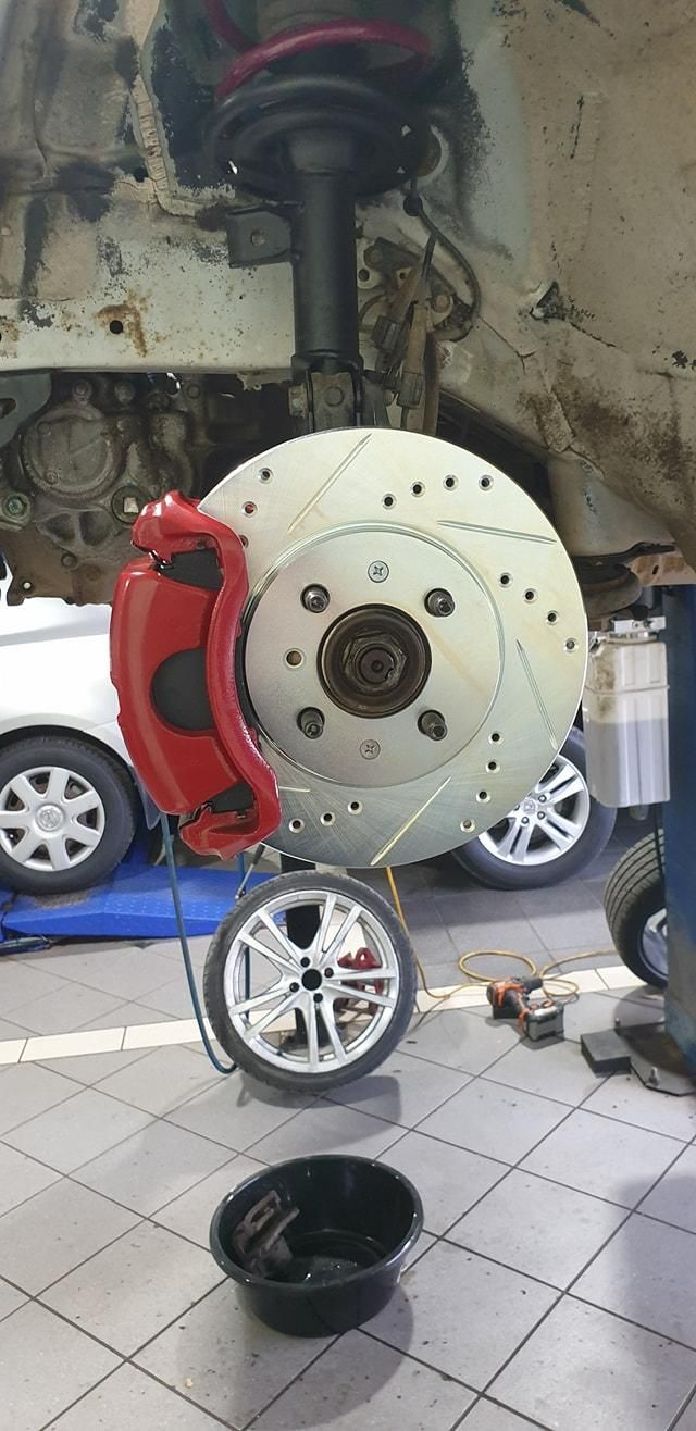 A Close up Of a Brake Disc on A Car in A Garage — TGR Automotive–Honda Specialist in Lismore, NSW