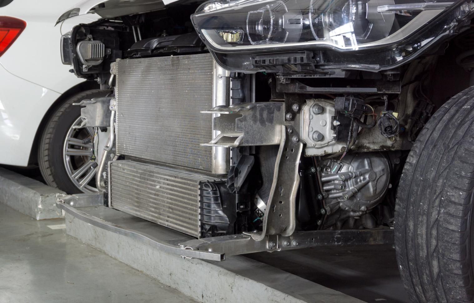 A White Car with The Front End Removed Is Parked in A Parking Garage — TGR Automotive–Honda Specialist in Lismore, NSW