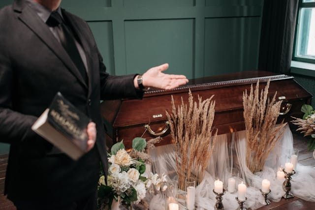 a trusted funeral director giving a speech for a service