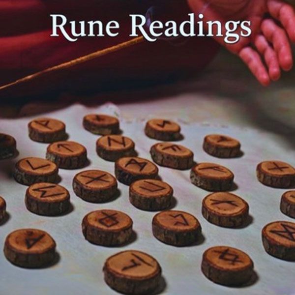 Runes laid out on a table beneath the title “Rune Readings”