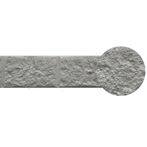 Gray stone wall fragment with a rounded end.