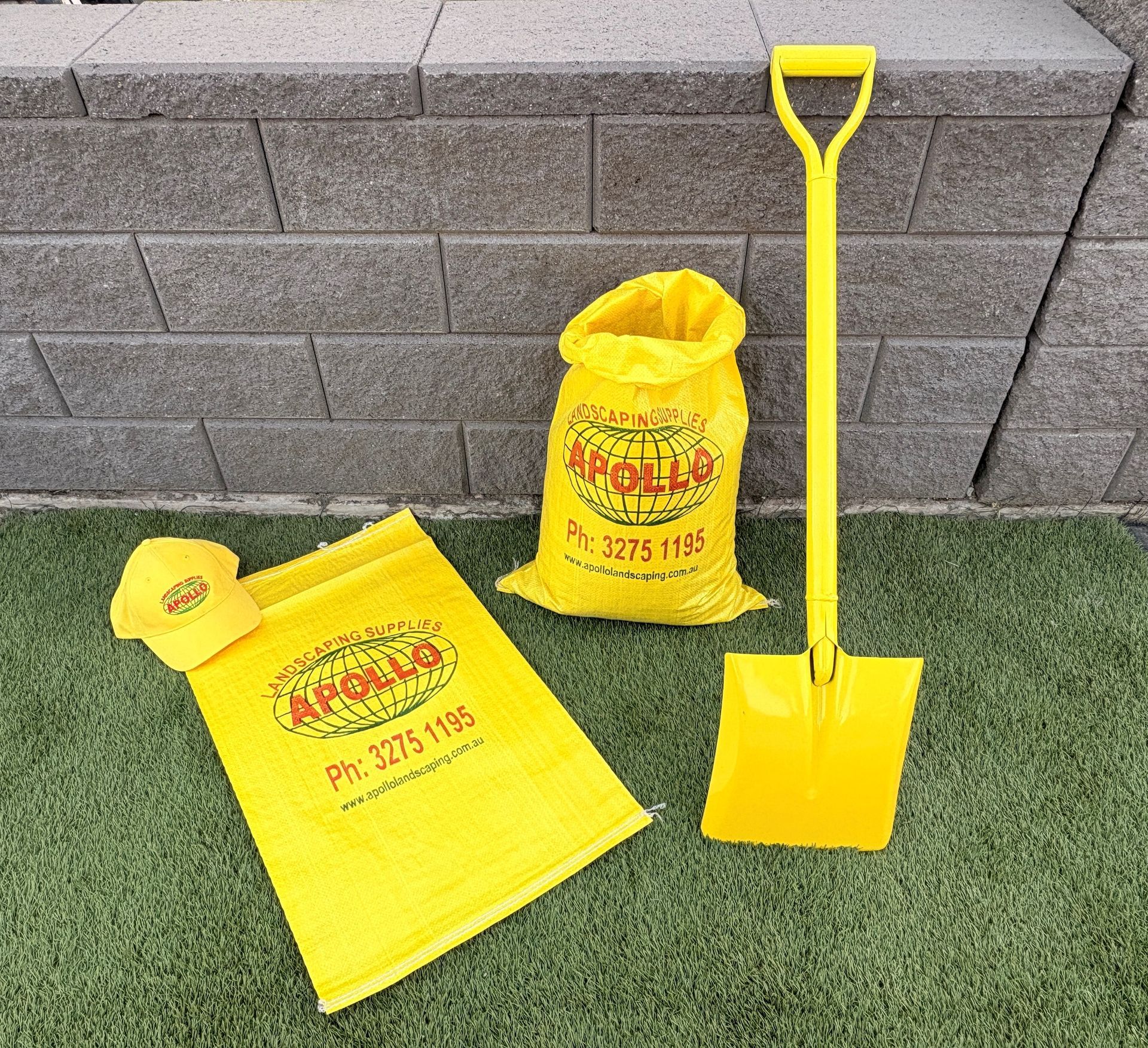 Yellow shovel, bags, and cap branded 