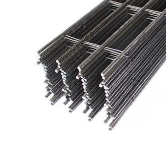 Stacked steel rebar mesh, used for reinforcement in concrete construction.