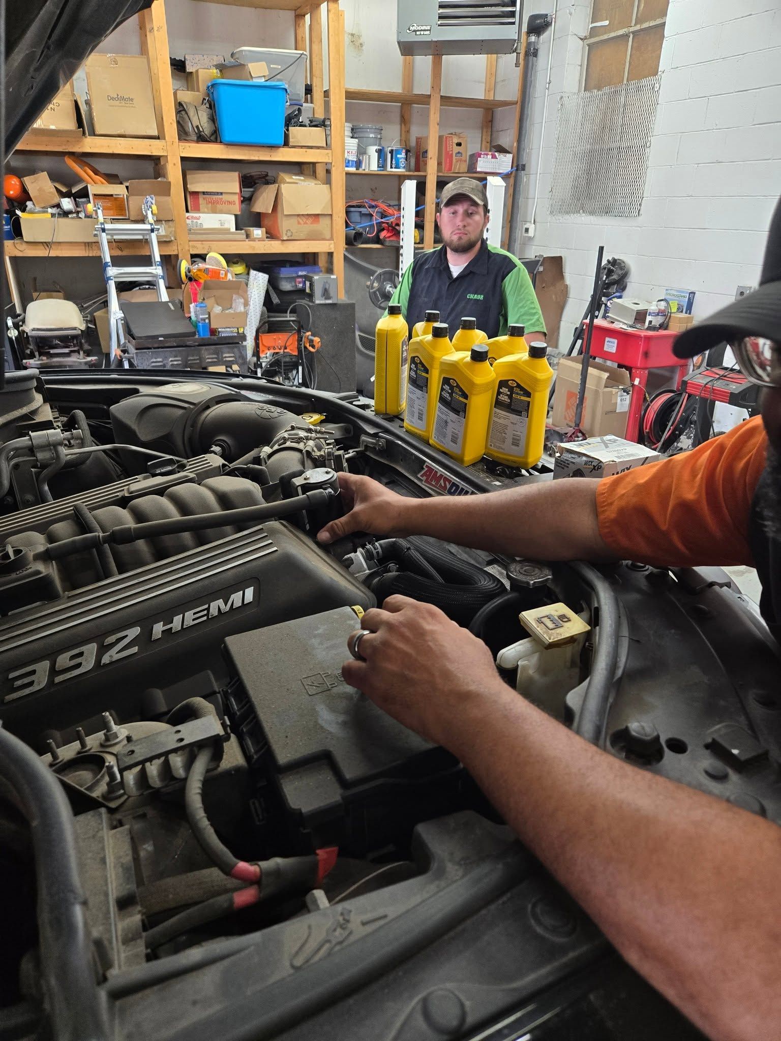Mechanic Performing Engine Maintenance In Shop | Burnout Boyz Garage LLC
