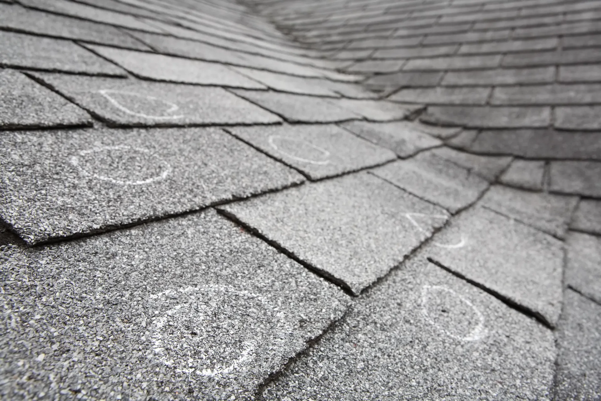 Gray shingle roof with visible weathered patches and overlapping rows