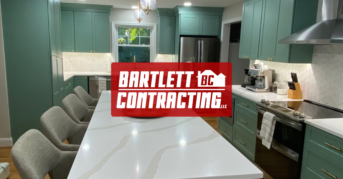 Modern green kitchen with white island and red Bartlett Contracting logo overlay