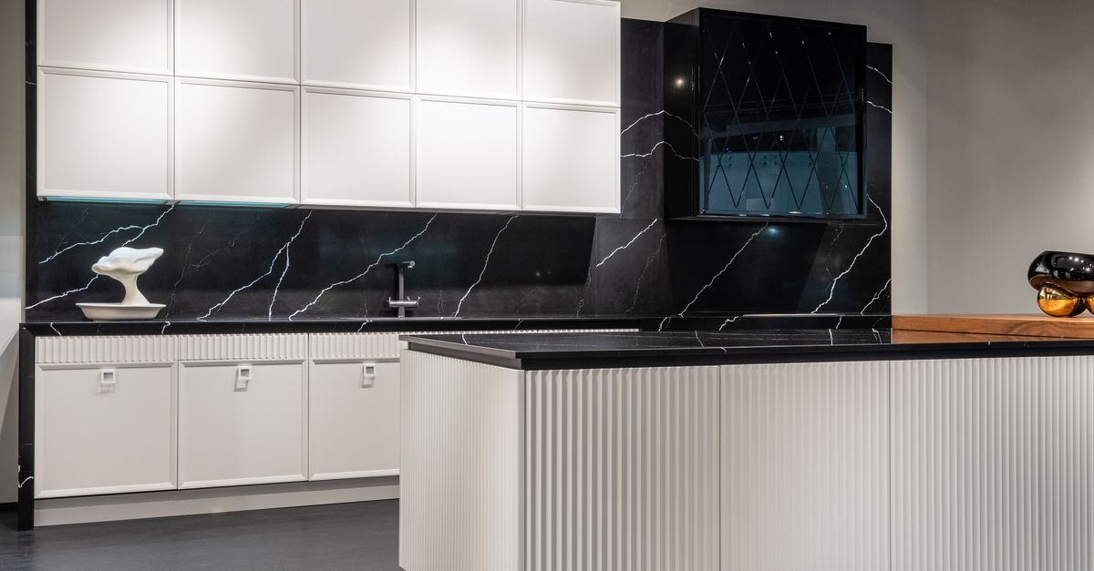 Showroom with cabinet, countertop, and flooring samples for ADU finish selections