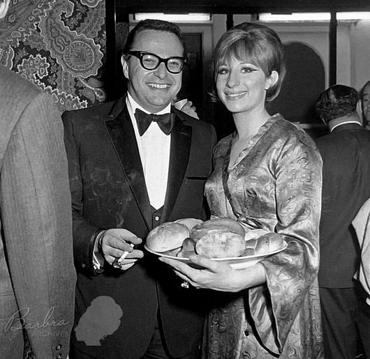 Marty Erlichman and Streisand at Funny Girl's opening night party on Broadway. She's a bagel on a plateful of onion rolls!