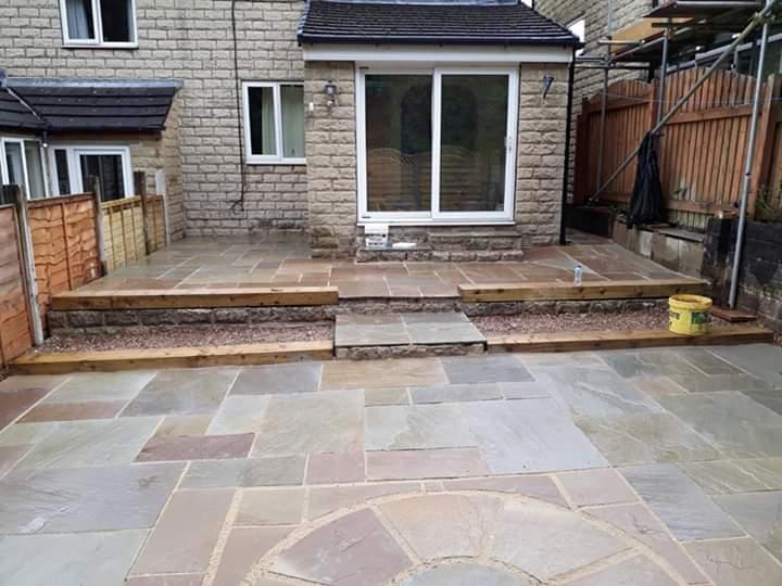 A completed patio with steps and circular pattern