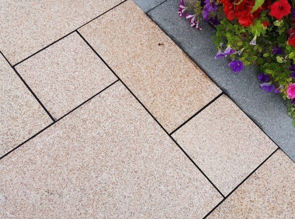 Yellow granite paving with dark granite edging