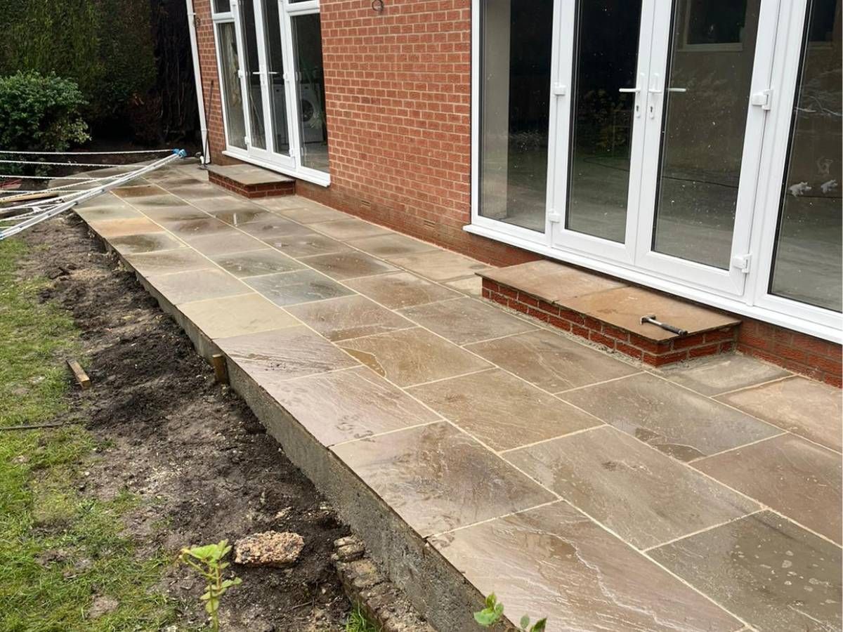 Patio laid along the back of a house in Harehills, Leeds