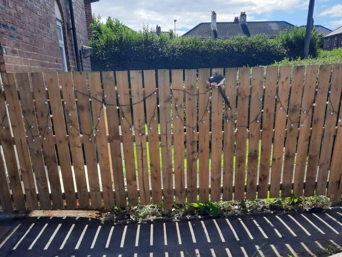 Flat-top picket style garden fence in Leeds