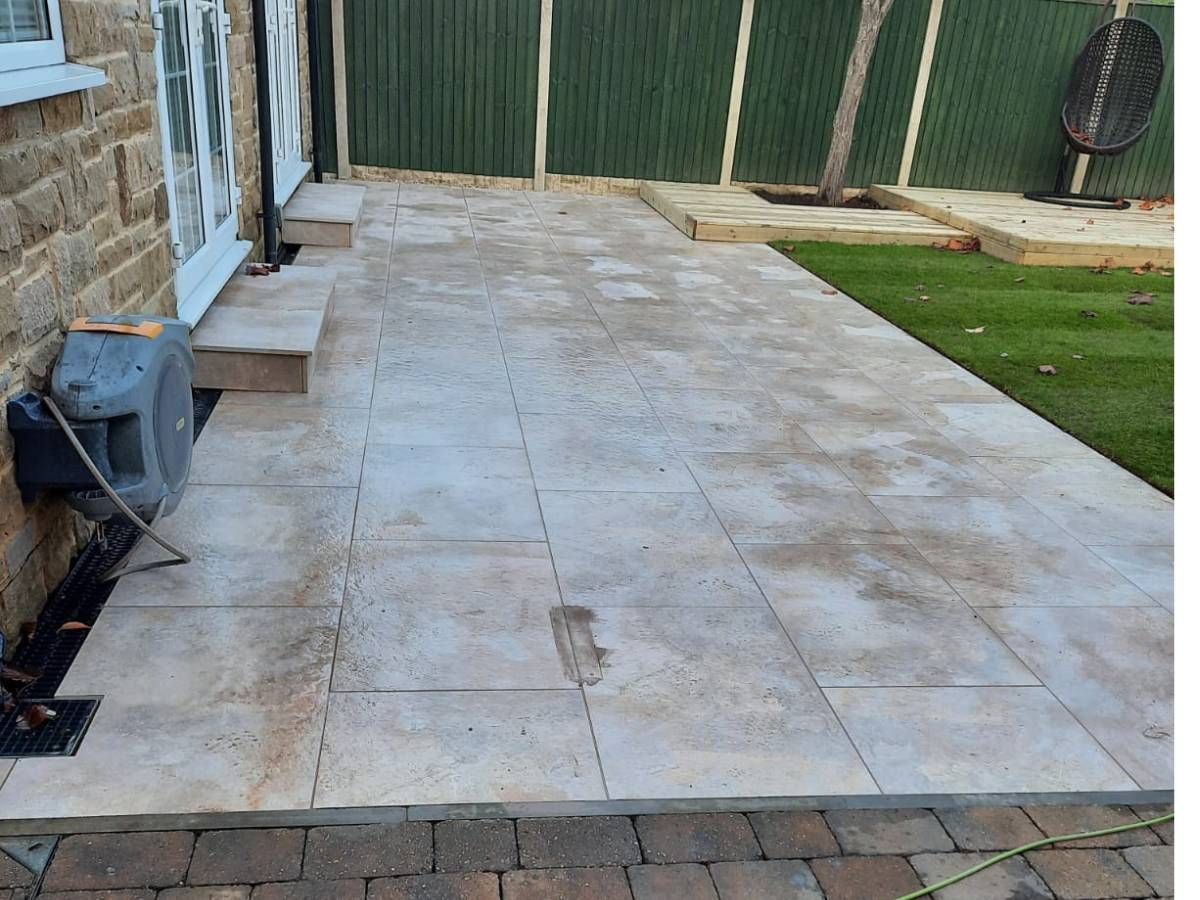 Light grey patio with a block paving edge in Chapeltown, Leeds