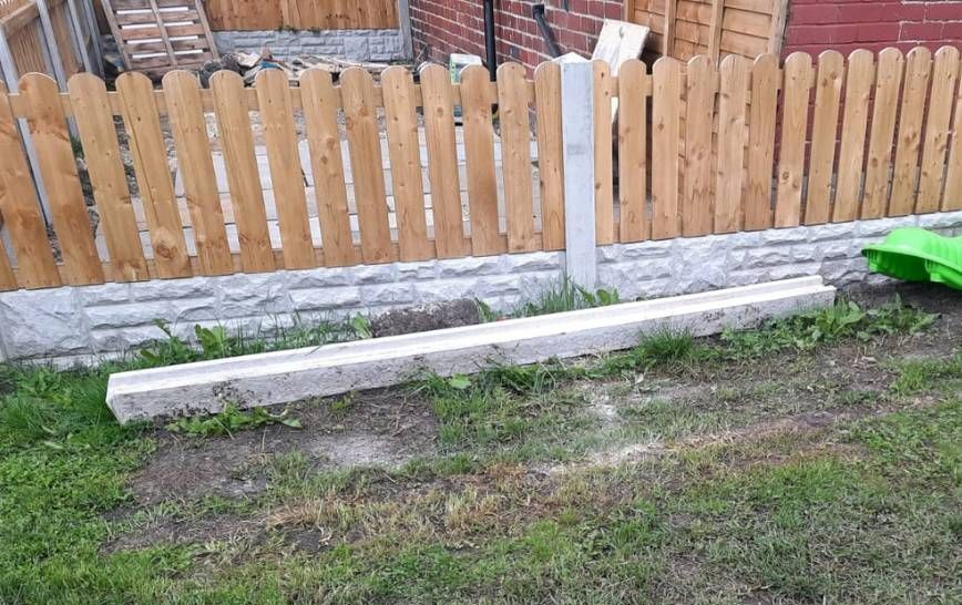 Short timber picket fence with concrete posts in Leeds