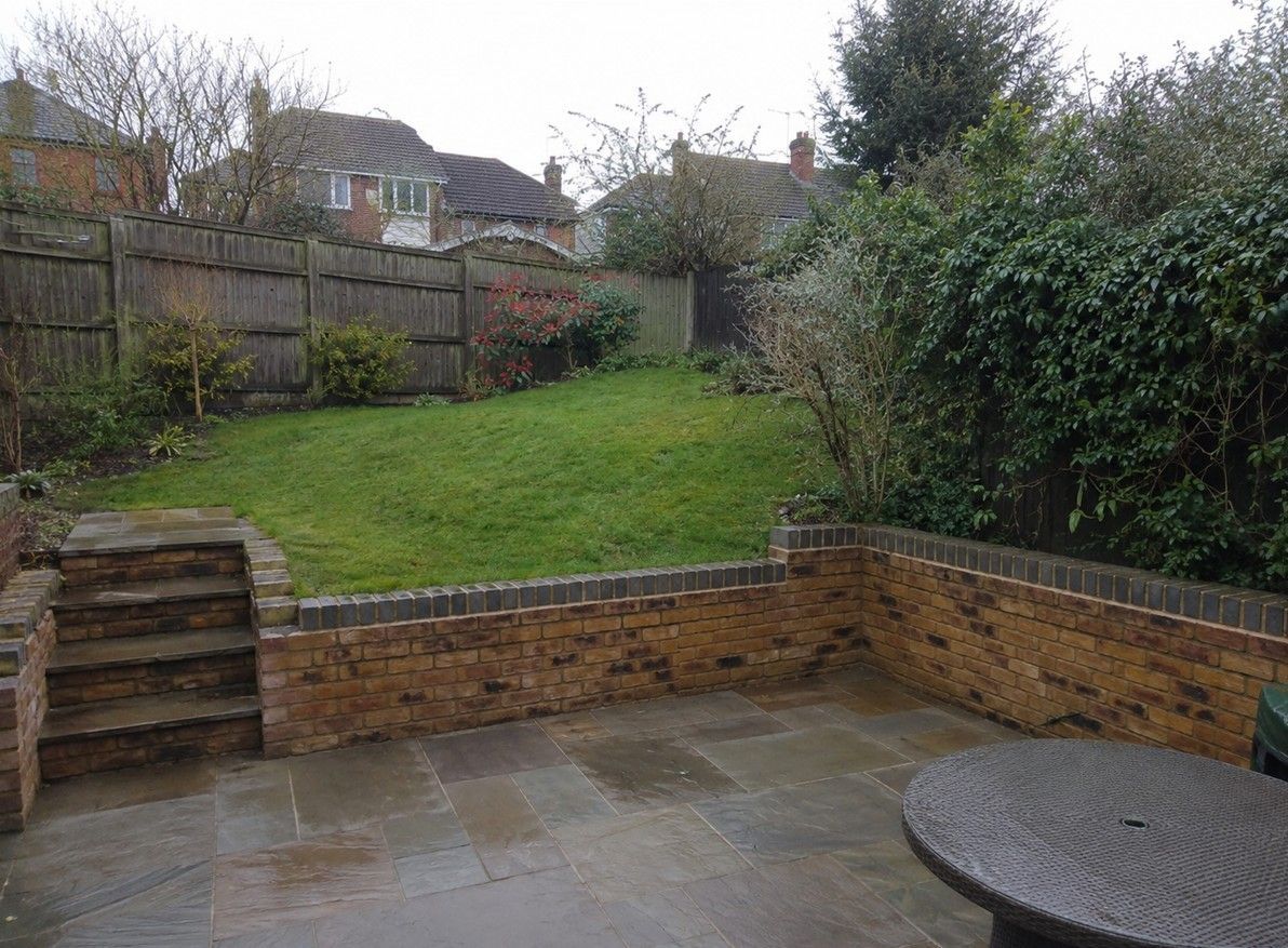 Landscaped garden with paving and retaining wall in Horsforth