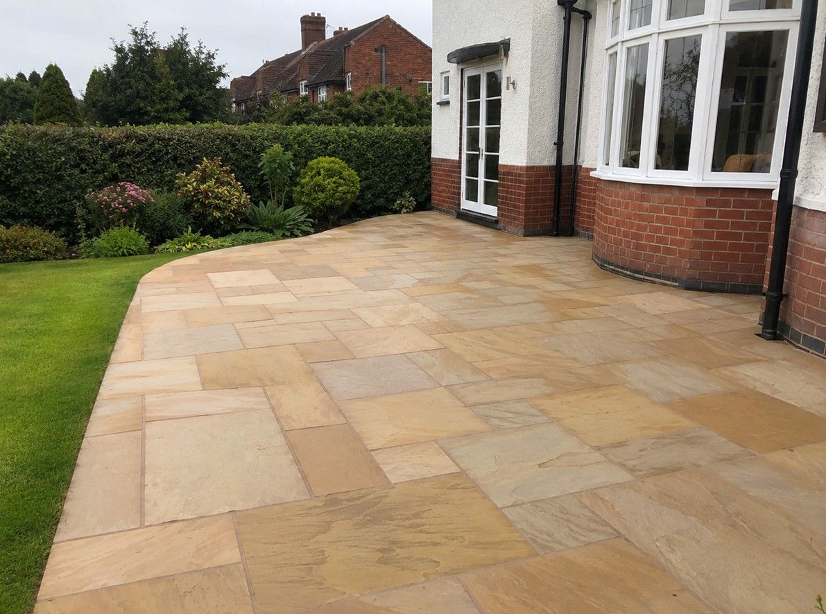 Indian sandstone patio installed in a large Alwoodley garden