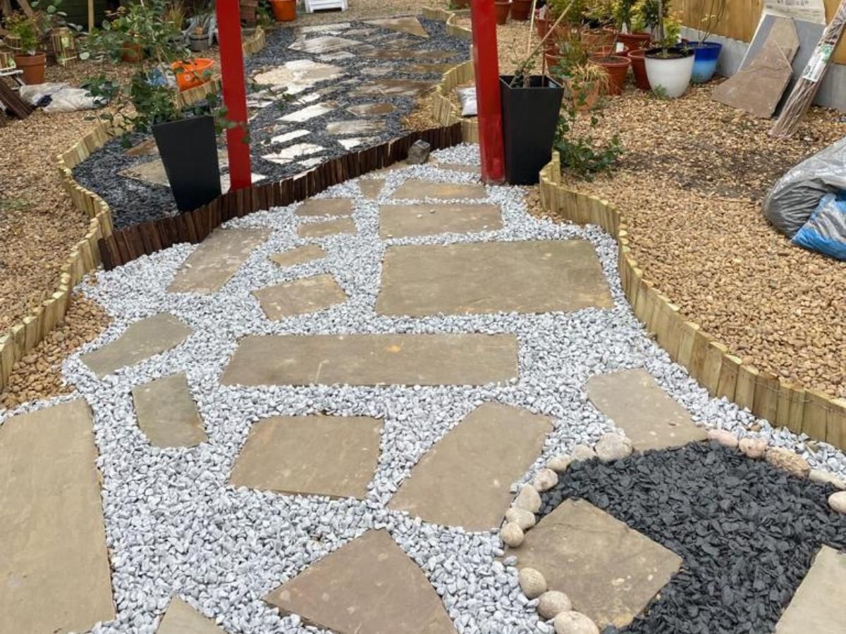 Landscaped garden with stepping stones and gravel in Leeds