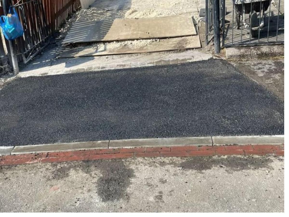 Tarmac driveway leading to a dropped kerb in Leeds