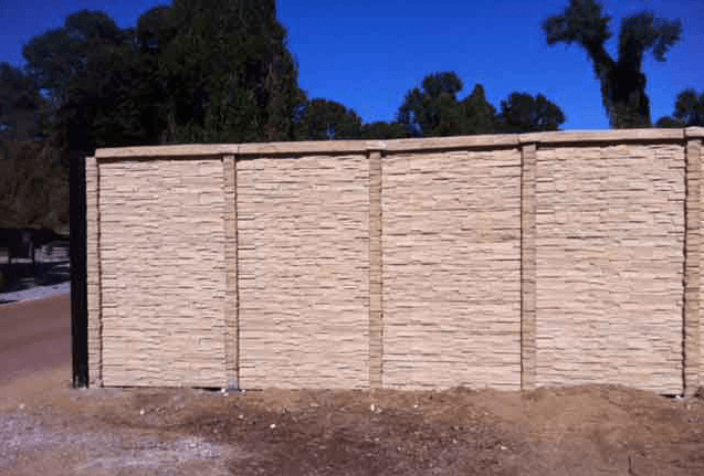 tall stone fence