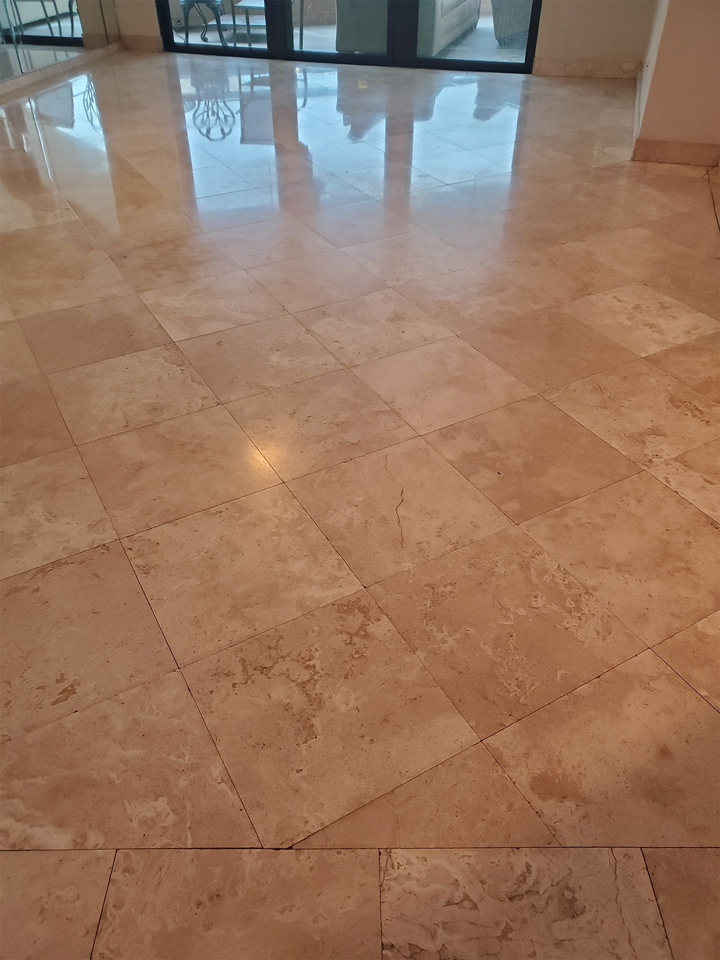 Polished travertine flooring with natural beige stone coloring