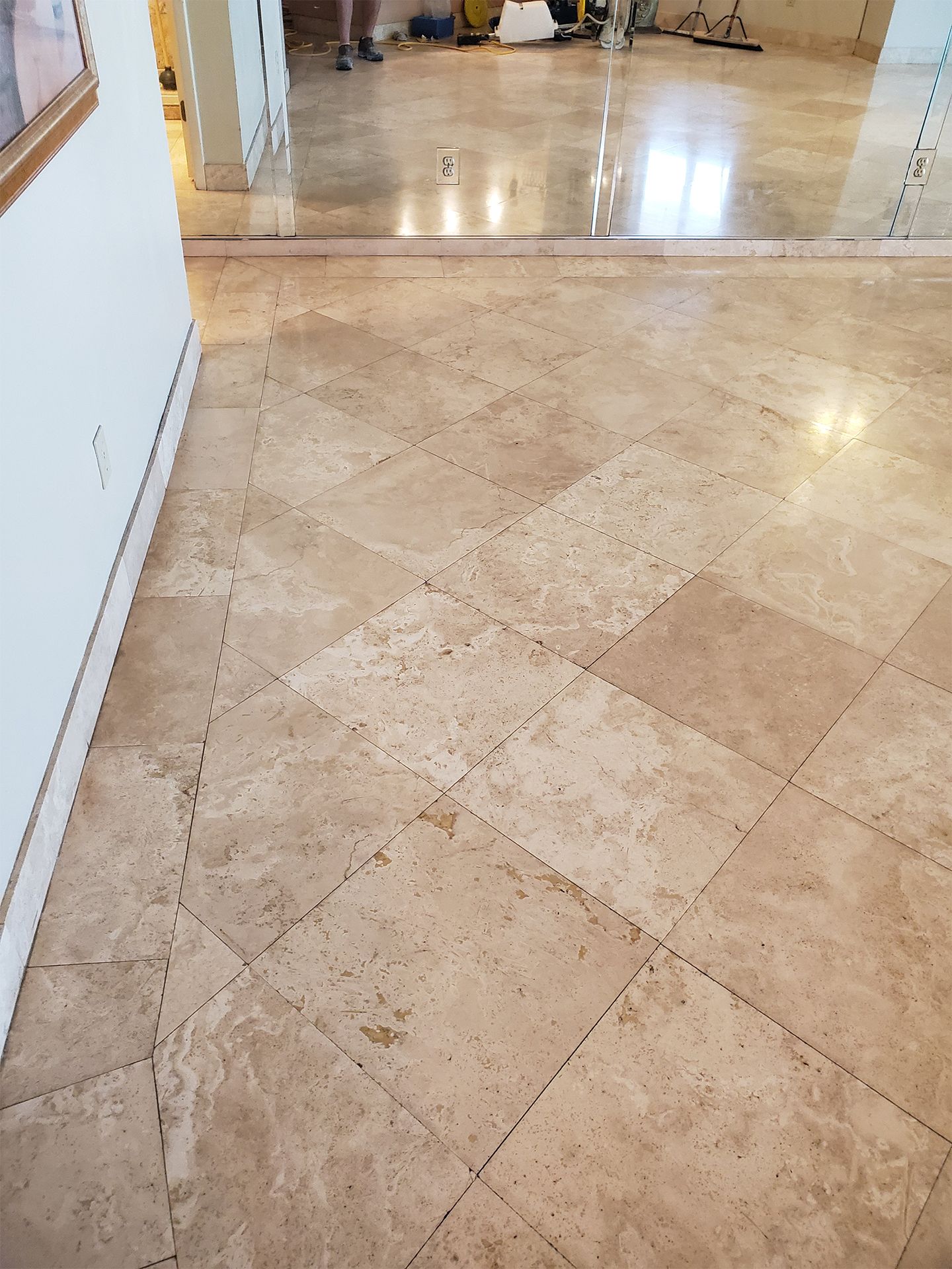 Restored travertine stone flooring with a smooth polished finish