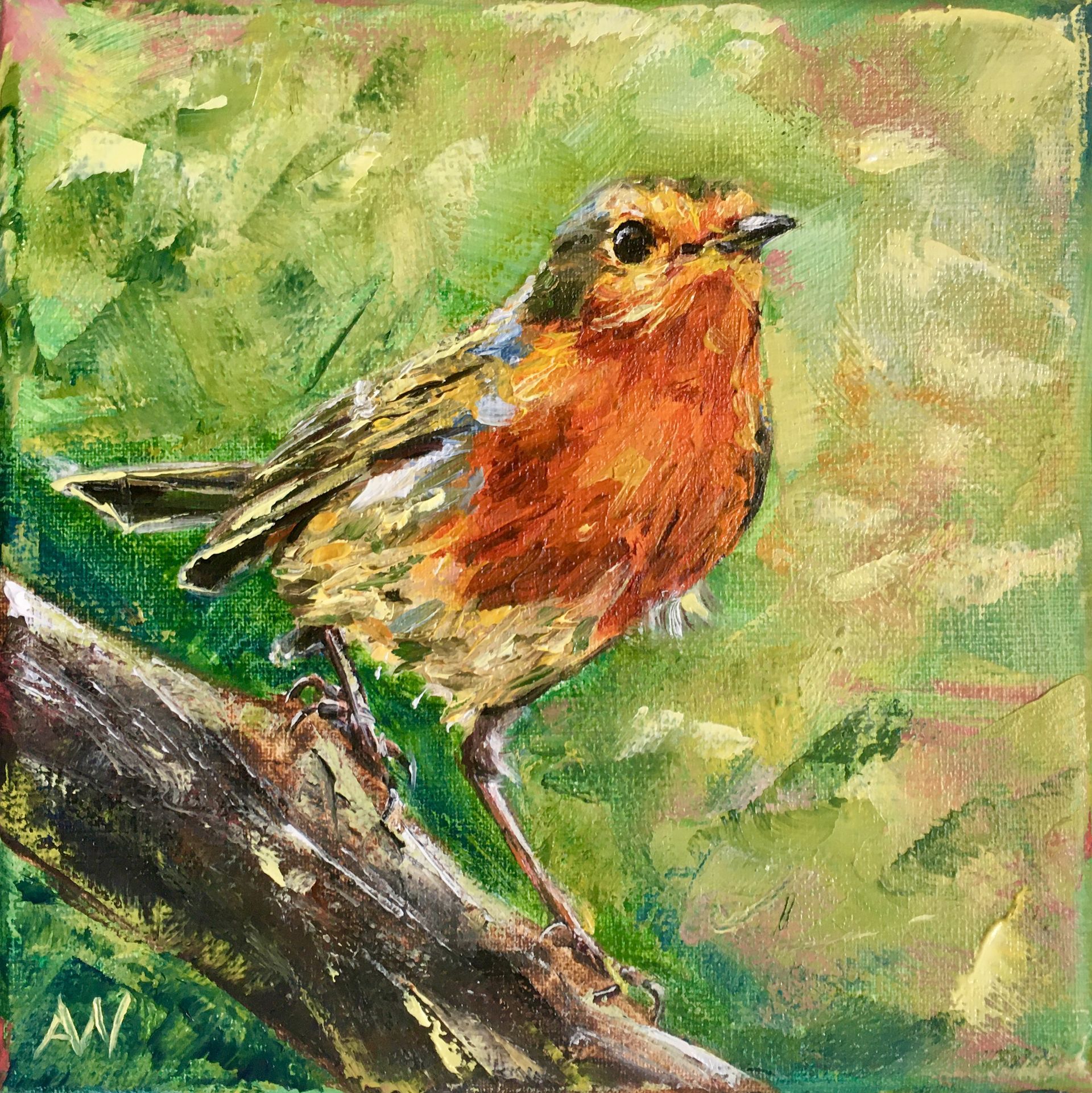 Robin with orange breast perched on a branch, green foliage background.