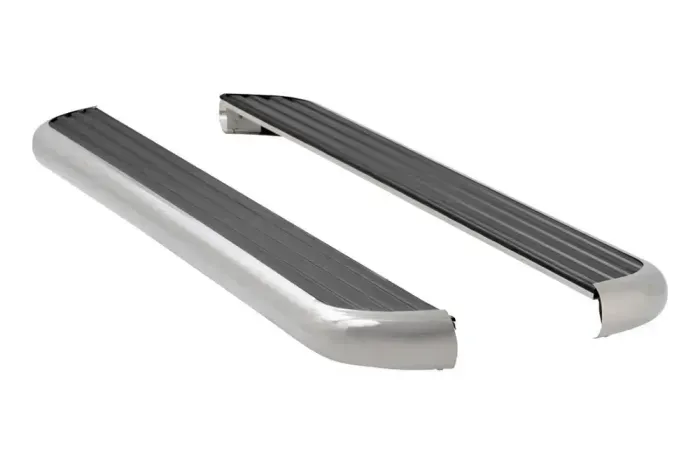 A pair of stainless steel side steps on a white background.