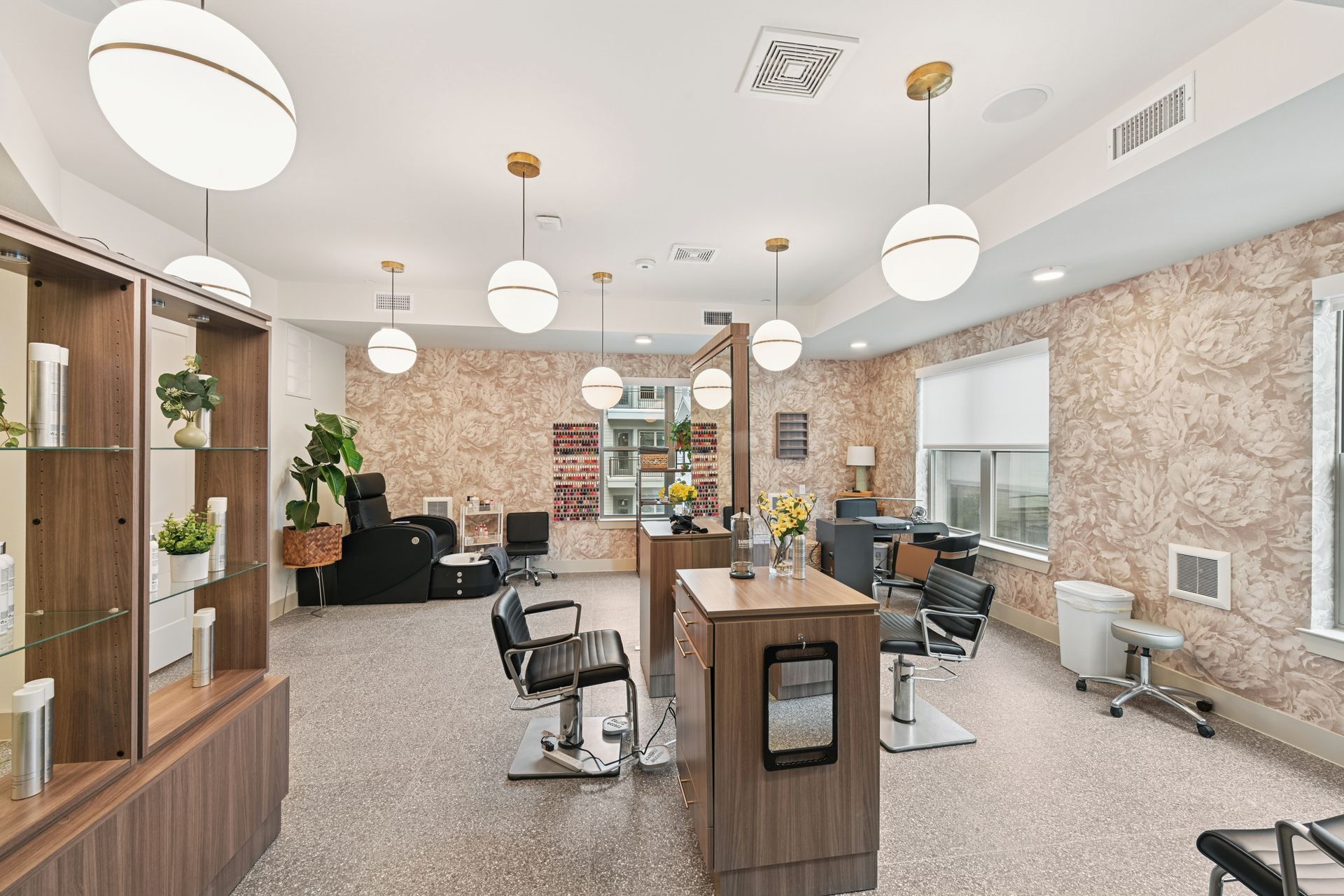 On-site resident salon with styling and pedicure chairs and mirrors.