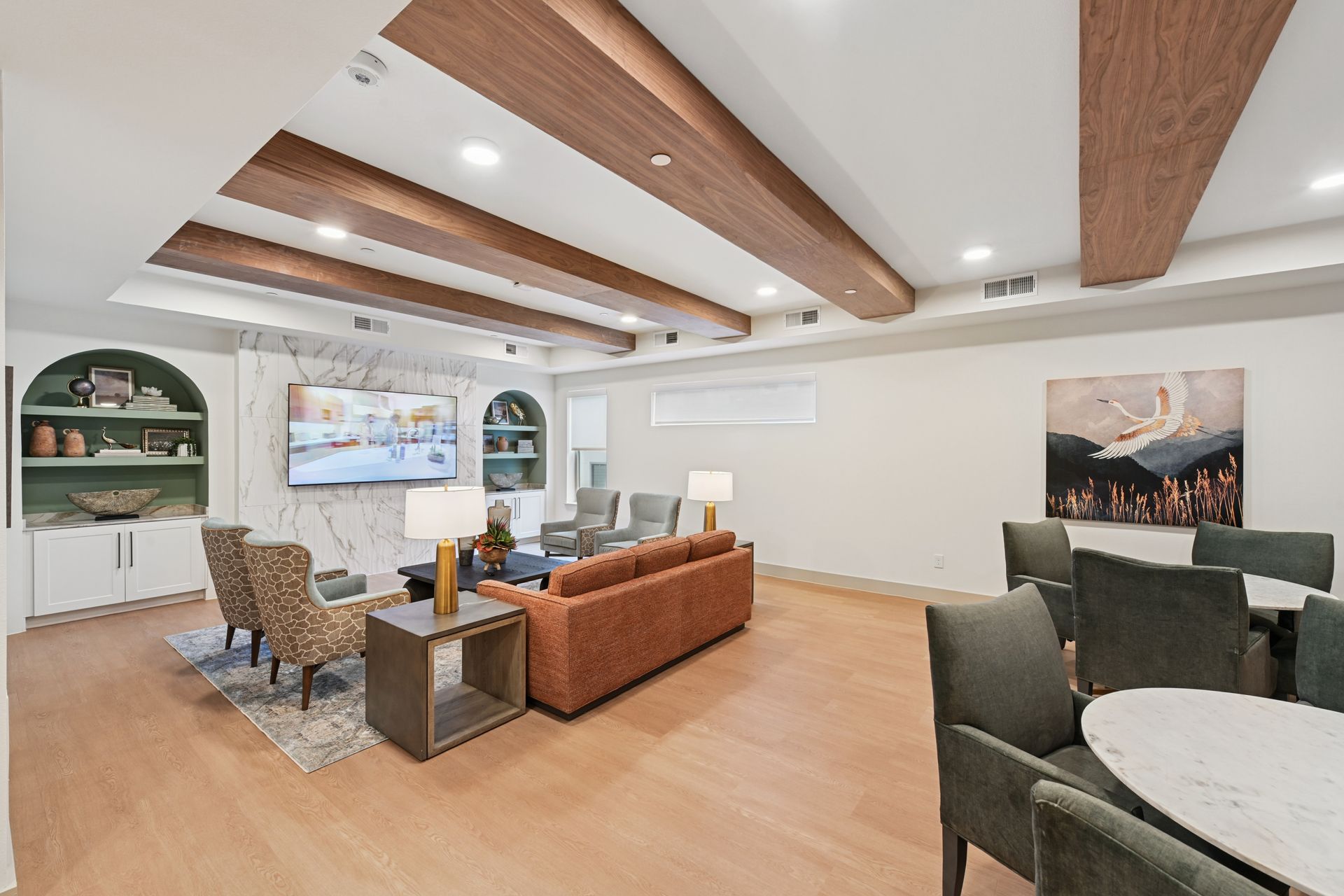 Apartment clubhouse lounge with wood beams and comfortable seating