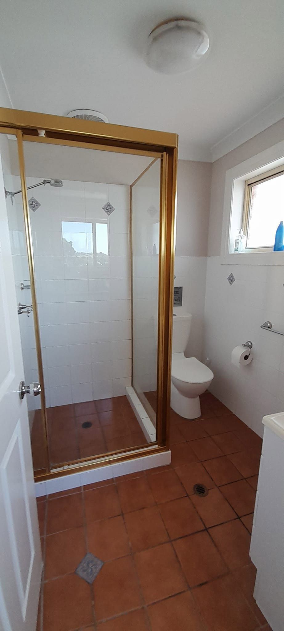 A Bathroom With A Toilet And A Walk In Shower — McCarthys Property Services in Maclean, NSW