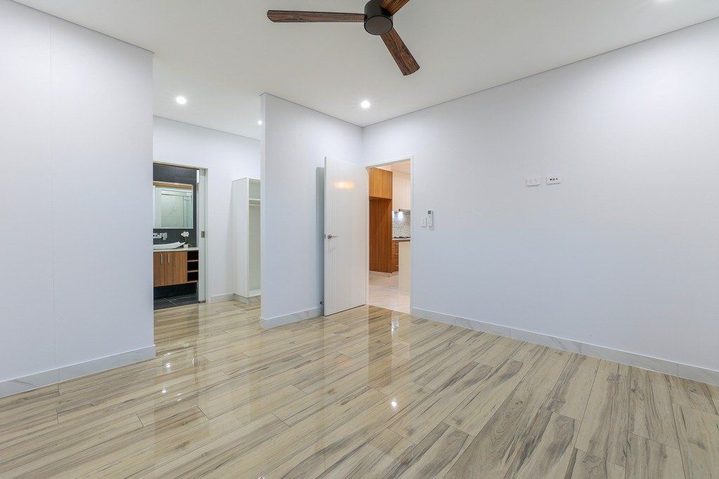 There is a ceiling fan in the middle of the room.