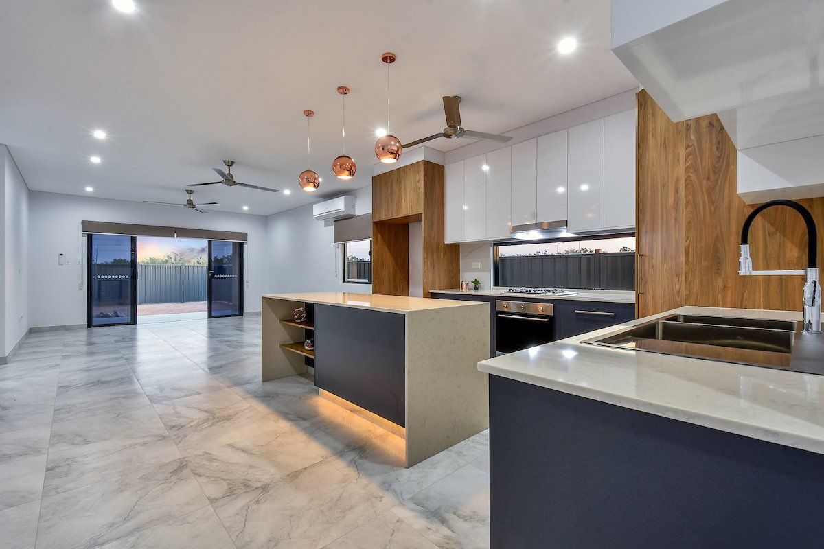 A kitchen with a large island in the middle of the room.