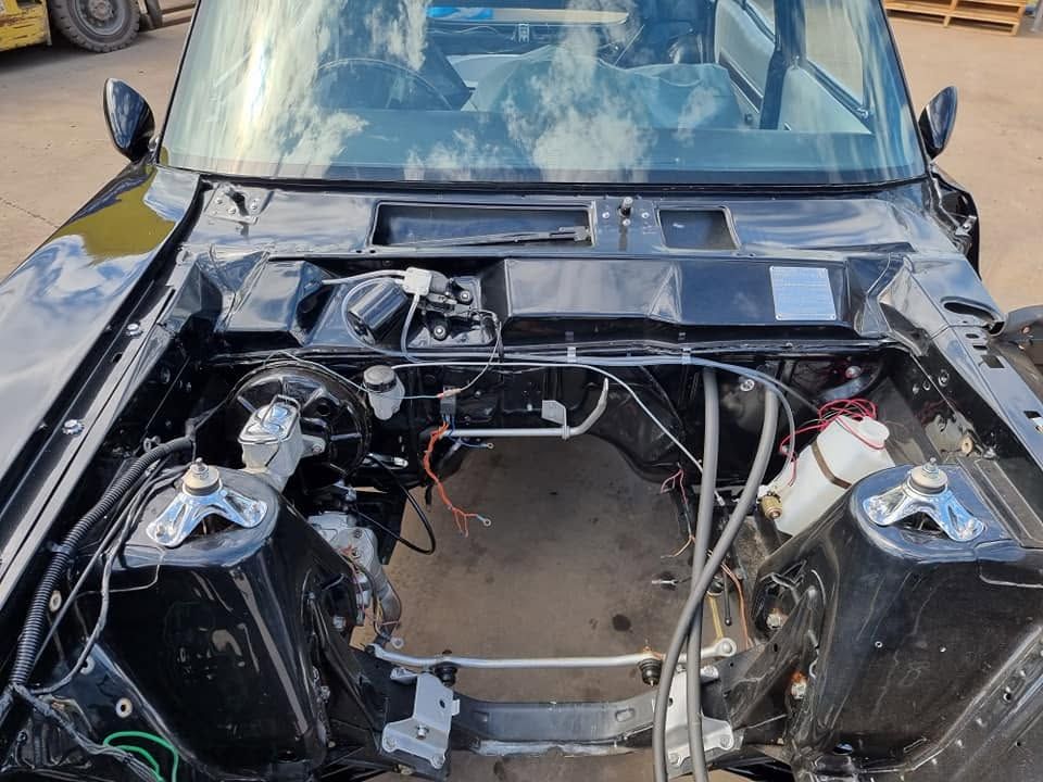 Car With Hood Removed, Showing an Empty Engine Bay and Exposed Metal Components — Goodyear Autocare Bowen in Bowen, QLD
