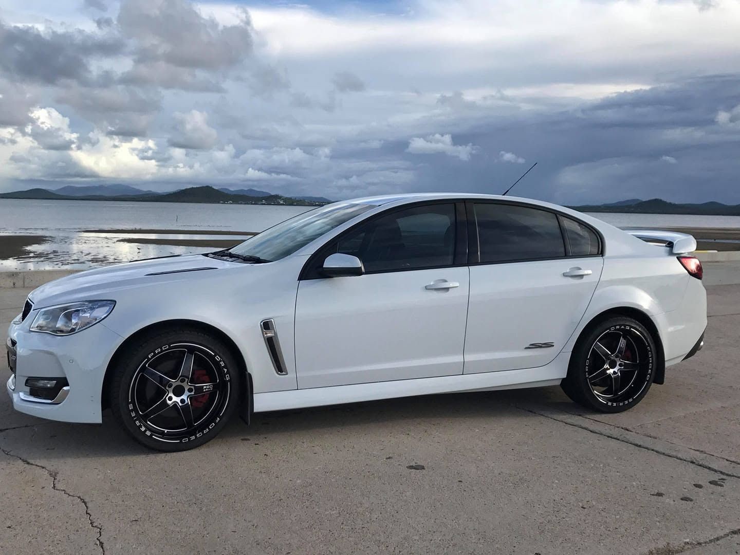 White Sedan Parked on a Waterfront Road — Goodyear Autocare Bowen in Bowen, QLD