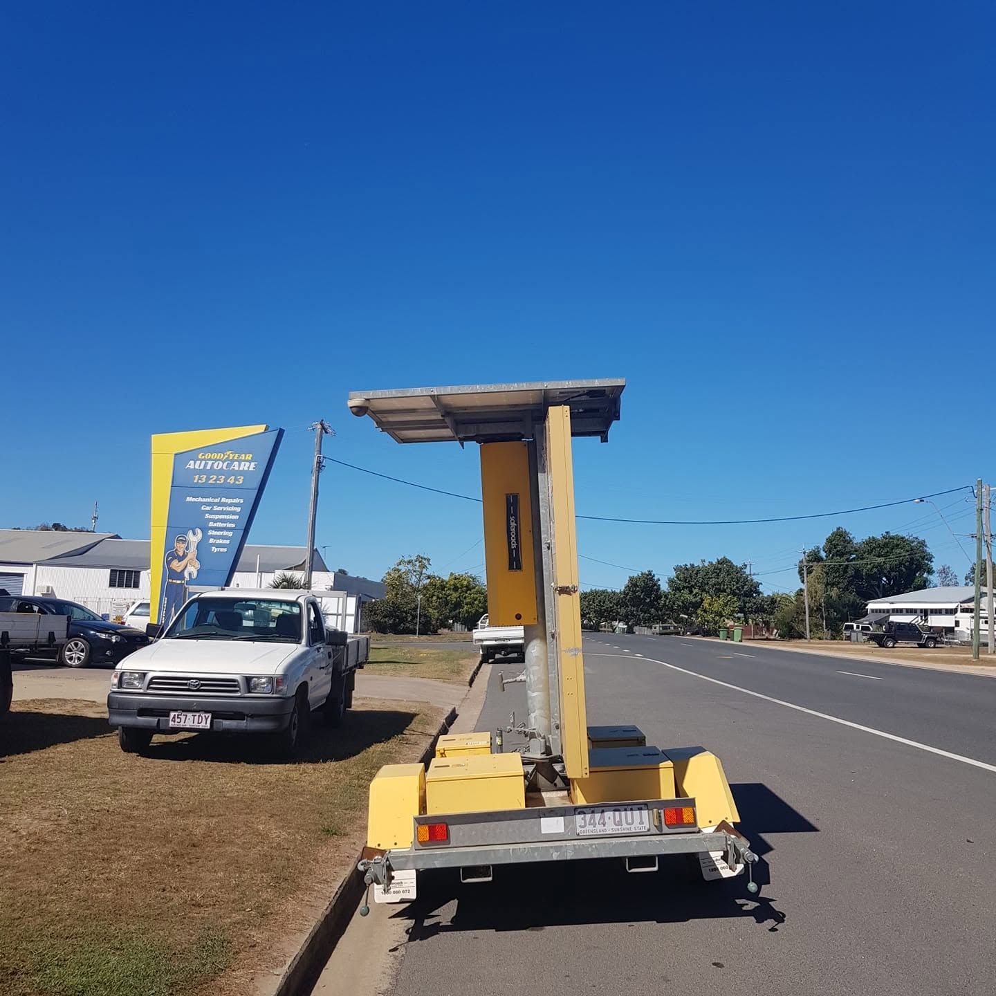 Yellow Road Maintenance Lift Trailer Parked Roadside — Goodyear Autocare Bowen in Bowen, QLD