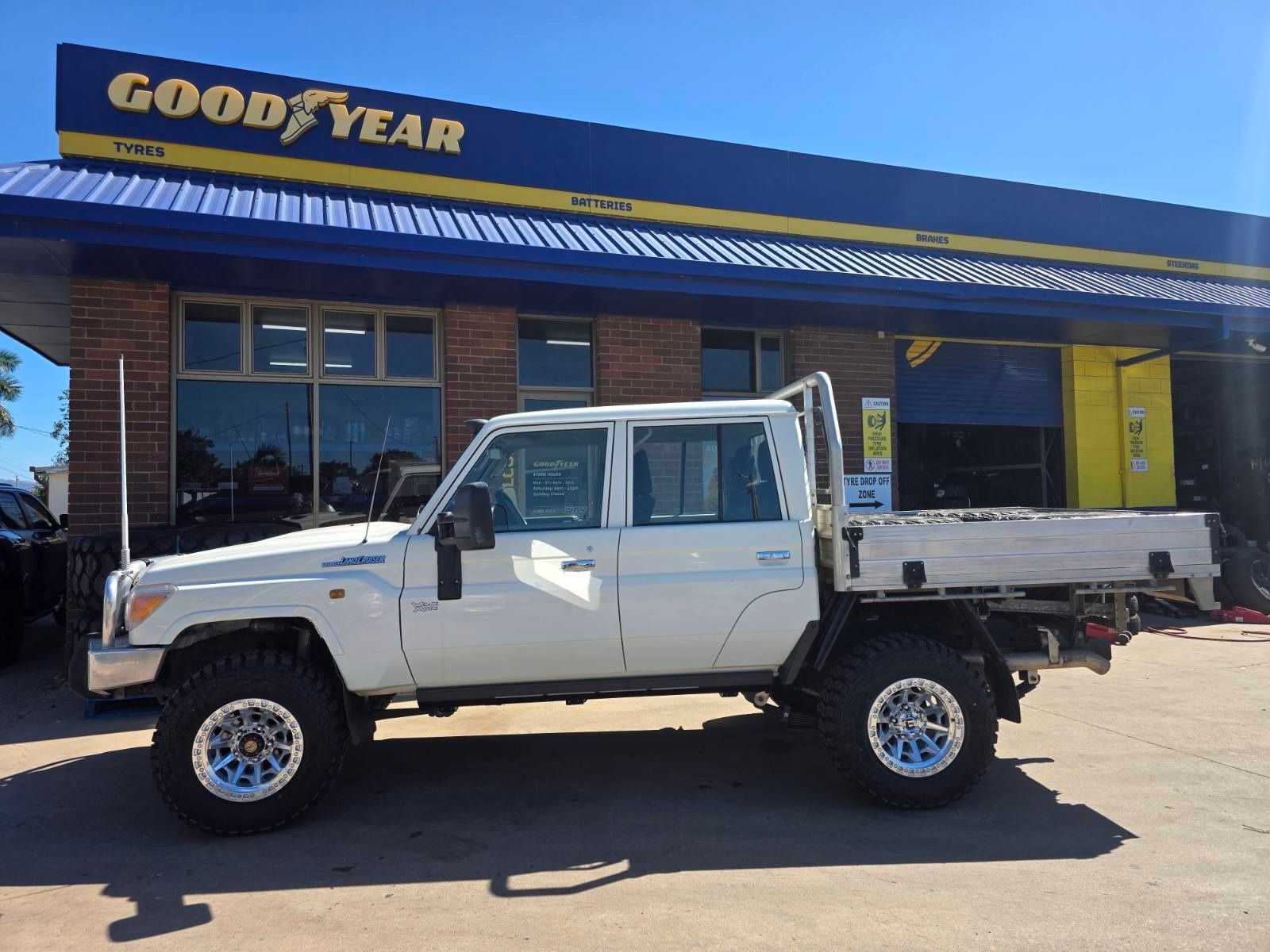 A Yellow And Black Jeep With The Word Boss On The Back — Goodyear Autocare Bowen in Bowen, QLD
